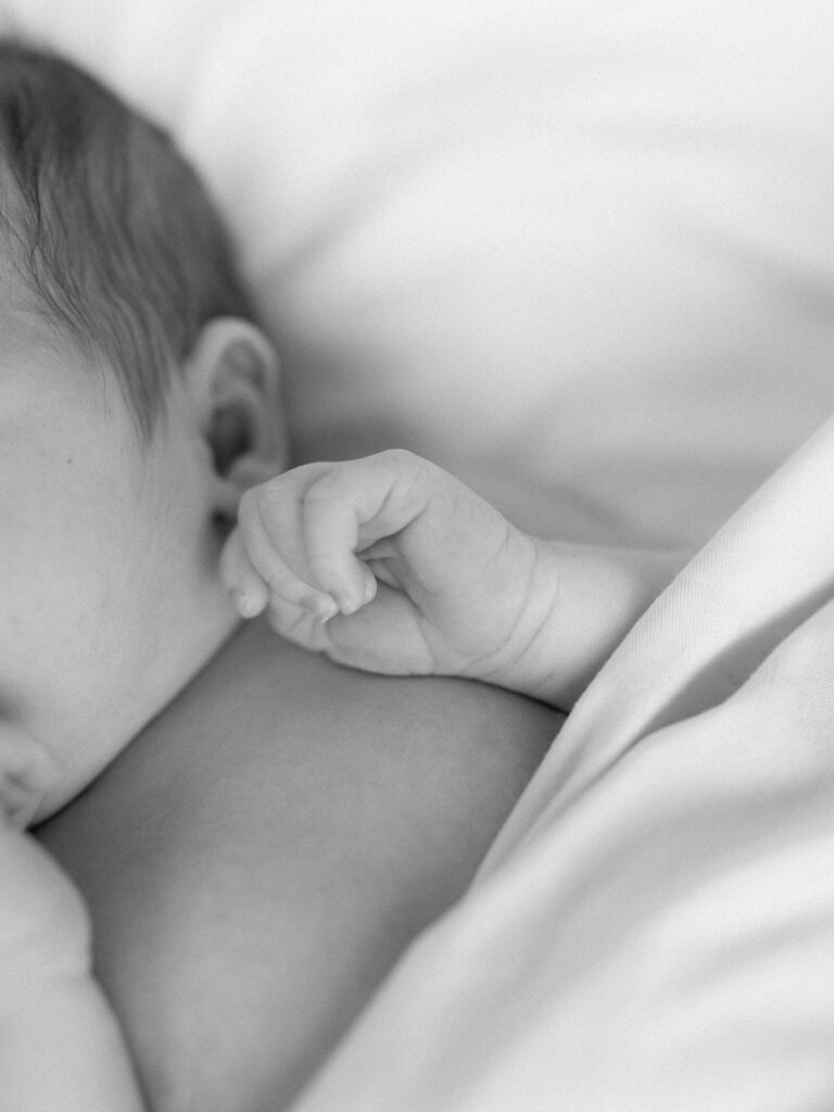 Photo of baby hand taken by College Station Newborn Photographer, Meg Staheli Photo.