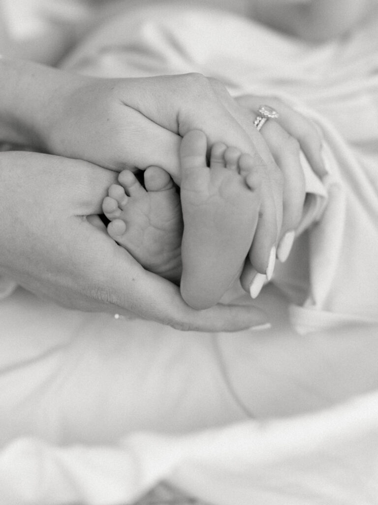 Photo of baby feet taken by College Station Newborn Photographer, Meg Staheli Photo.