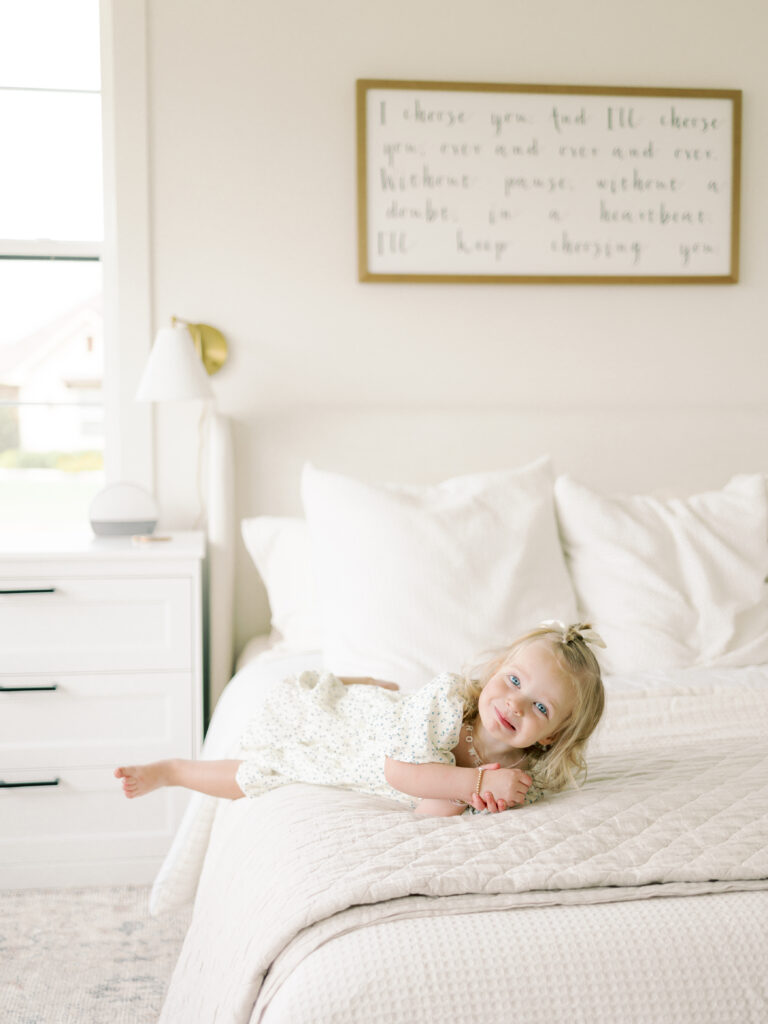 Photo of toddler during a newborn photoshoot taken by College Station Newborn Photographer, Meg Staheli Photo.