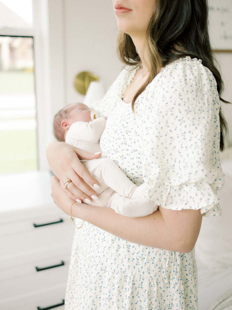 Photo of mom and baby taken by College Station Newborn Photographer, Meg Staheli Photo.