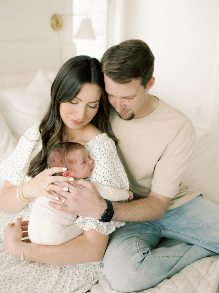 Photo of parents and baby taken by College Station Newborn Photographer, Meg Staheli Photo.