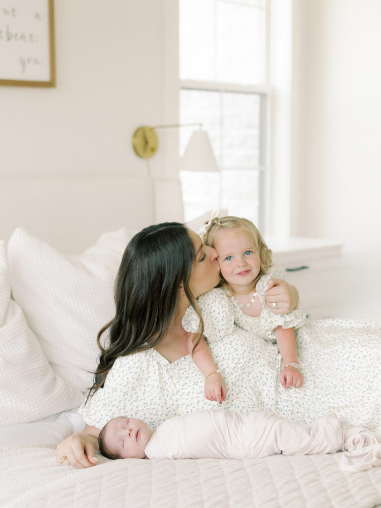 Photo of mom, toddler, and baby taken by College Station Newborn Photographer, Meg Staheli Photo.